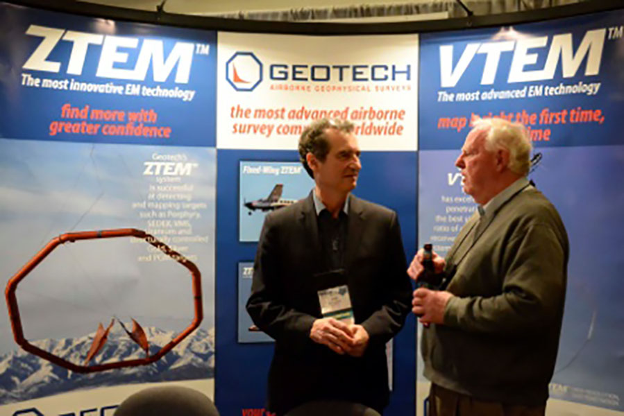 Geotech's Jean Legault in front of Geotech conference booth.